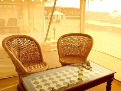 Photo showing 2 Chair with a table in Sitting area at Exotic Luxury Camps